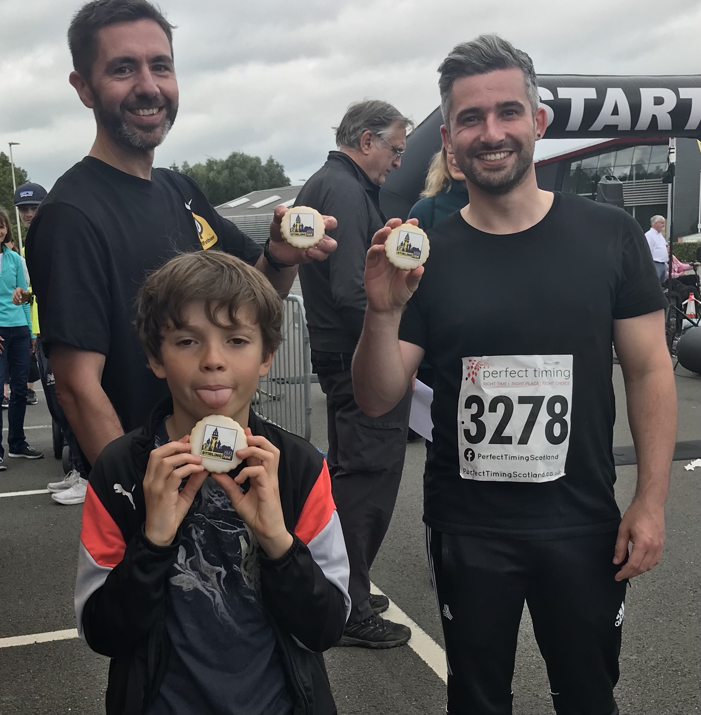 three people wearing sports clothing with biscuits