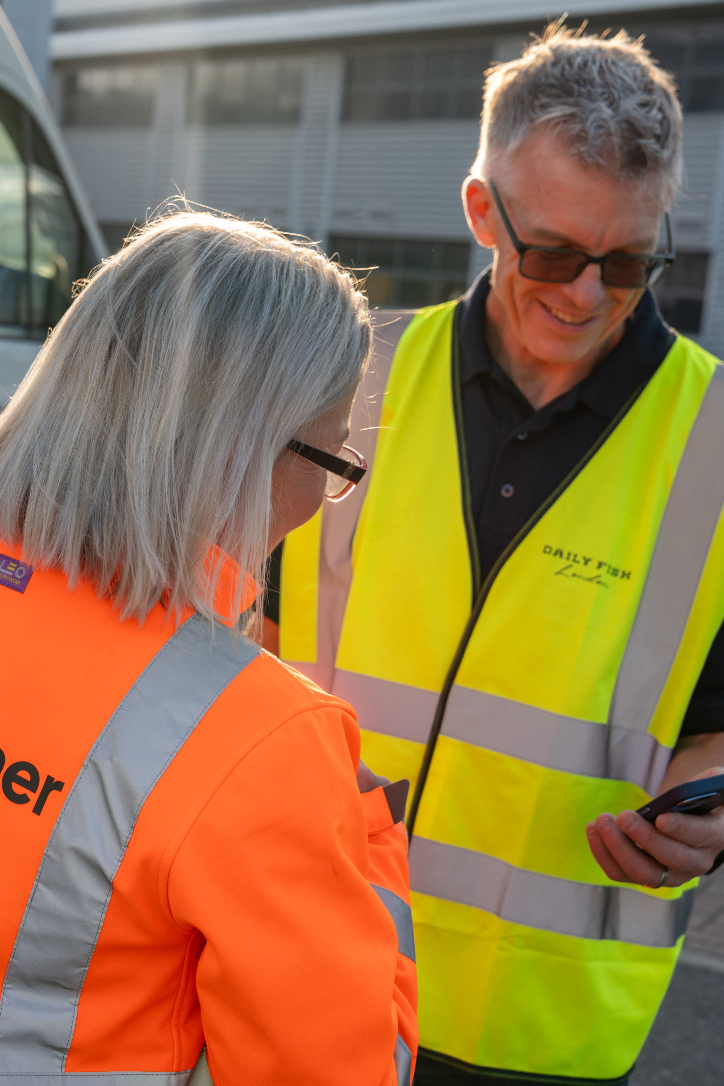Man and a women looking at a mobile phone